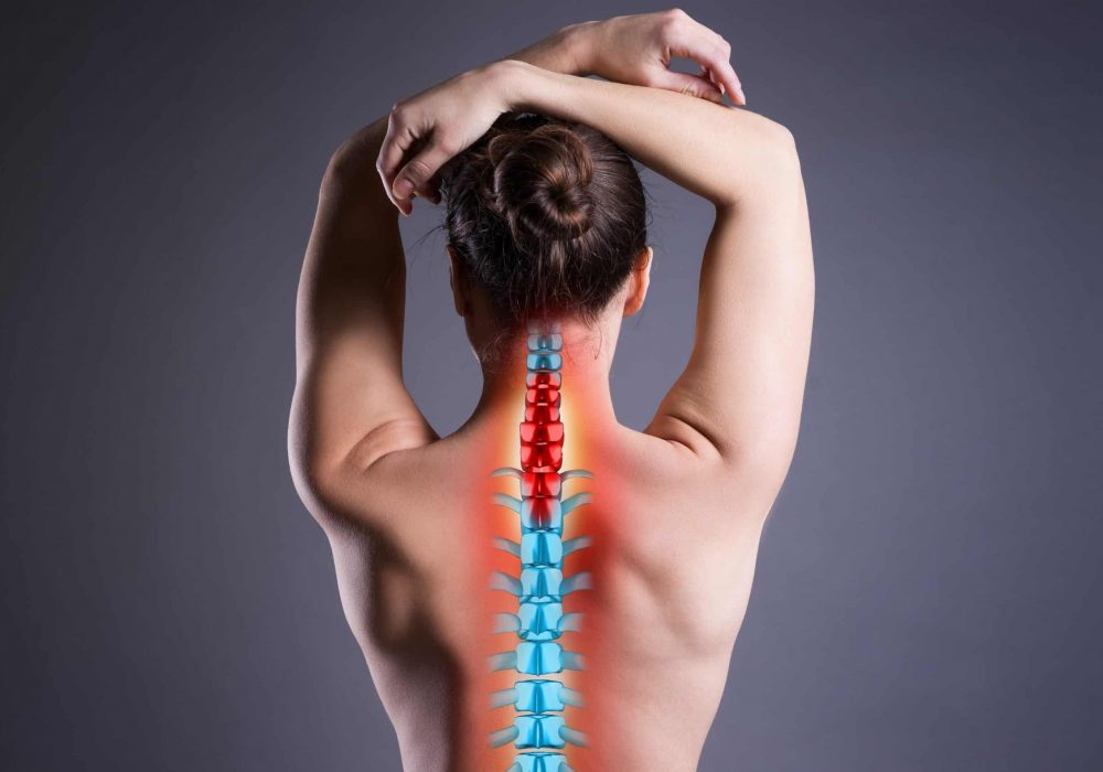Pain,In,The,Spine,,Woman,With,Backache,On,Gray,Background,