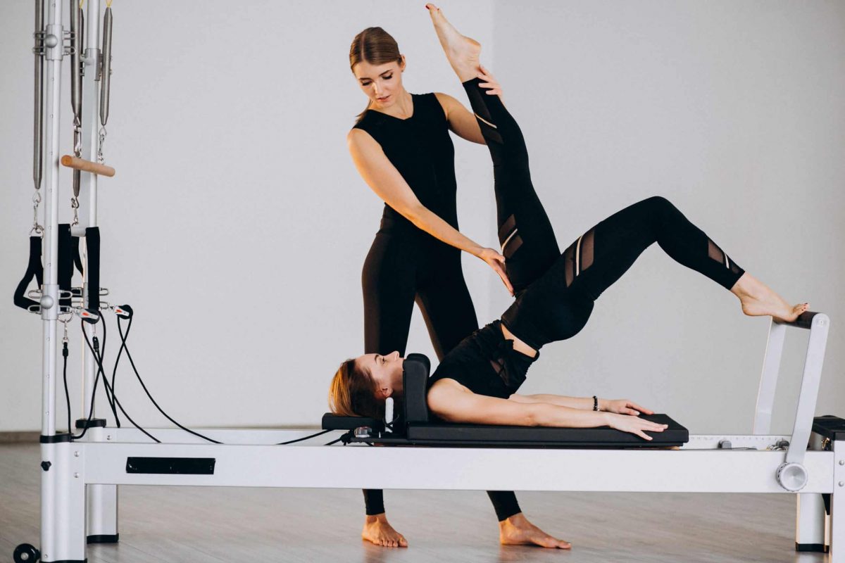 Women,Doing,Pilates,On,A,Reformer